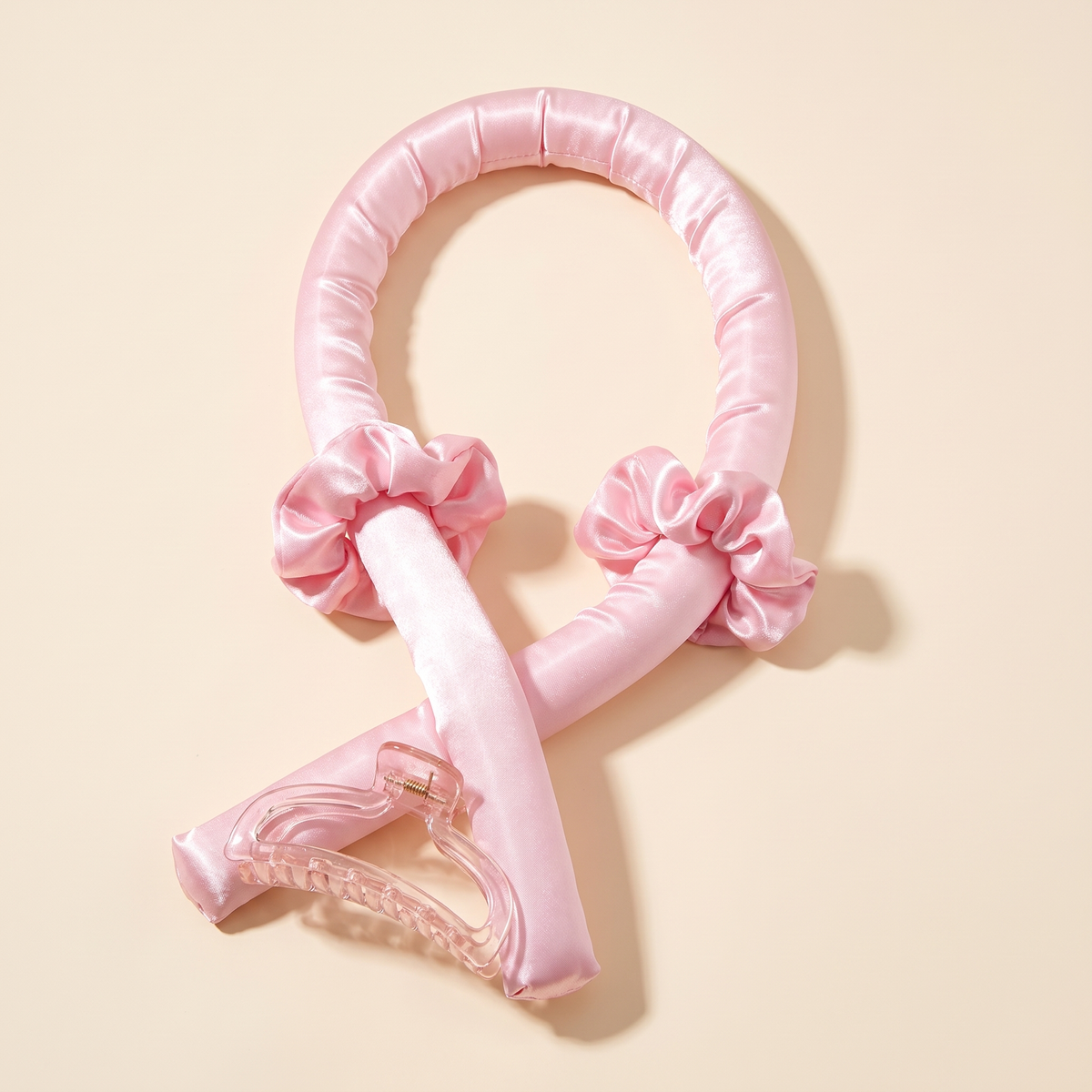 LunaCurl glossy pink satin heatless curling band with two scrunchies and a claw clip