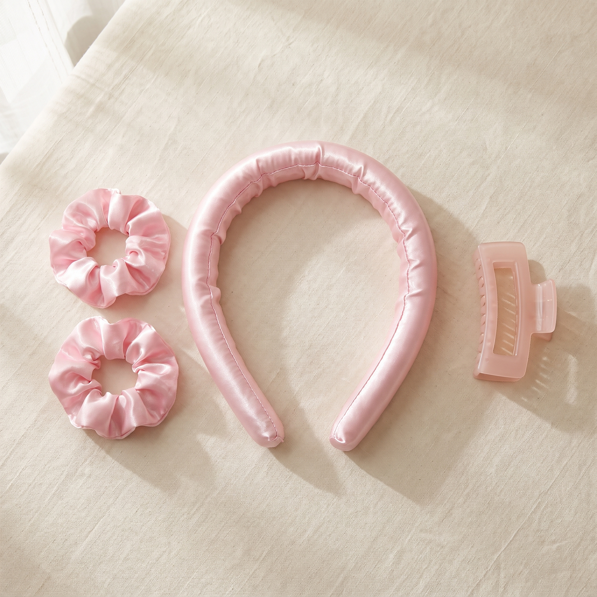 LunaCurl complete set flat lay: satin band, two matching scrunchies and a claw clip